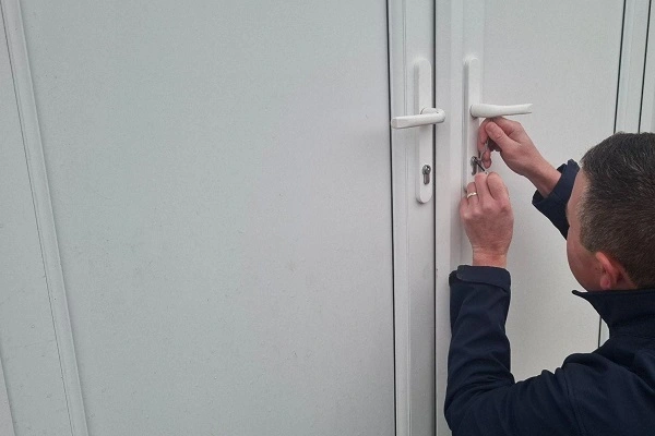 Emergency locksmith carrying out a non-destructive entry for a customer locked out after losing their keys.